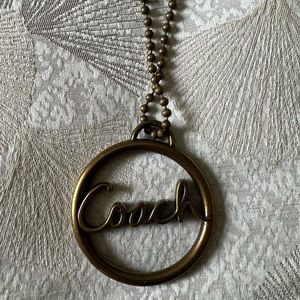 A Vintage Coach brass Metal Ring keychain